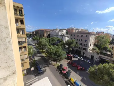 a view of a city street with cars and buildings at Casa Vacanze Bianca - Metro A - Furio Camillo in Rome