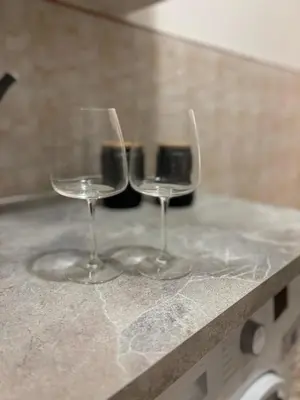 two wine glasses sitting on top of a counter at Luxury Apartment in Prati in Rome