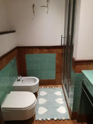a bathroom with a toilet and a sink at Bikehouse in Rome