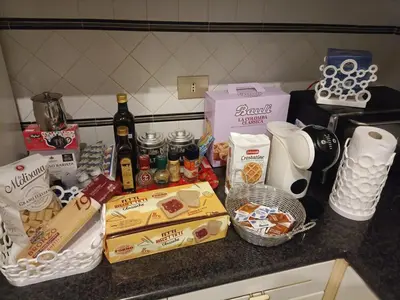 a counter with food and drinks and other items on it at large Vatican loft near the metro in Rome