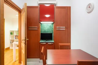 a room with a desk with a computer in it at The Roman Sketchpad, Few Steps from Villa Borghese in Rome