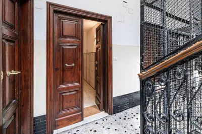 an open door of a building with a wrought iron gate at Haven25 in Rome