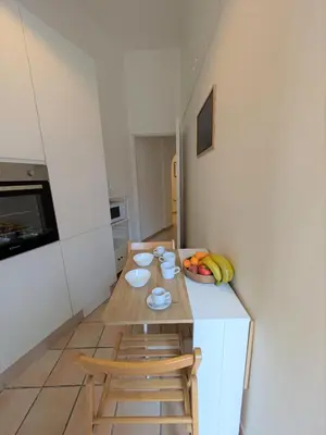 a small kitchen with a table and two chairs at Haven25 in Rome