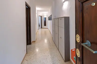 an empty hallway with a door and a hallway with a hallway at Haven25 in Rome