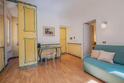 a living room with a couch and a table at Roman Forum apartament in Rome