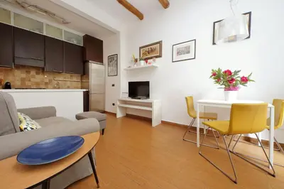 a living room with a couch and a table at Viale Trastevere by Halldis in Rome