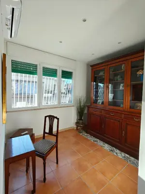 a dining room with a table and a chair at CasAdelia in Rome