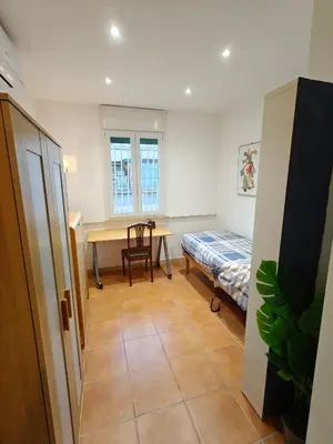 a room with a table and a bed and a desk at CasAdelia in Rome
