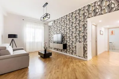 a living room with a couch and a tv at A Casa di Nico - Metro B1 Conca d 'Oro in Rome