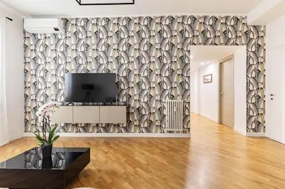 a living room with a wall mural of fishes at A Casa di Nico - Metro B1 Conca d 'Oro in Rome