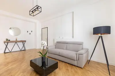 a living room with a couch and a table at A Casa di Nico - Metro B1 Conca d 'Oro in Rome