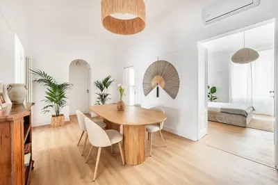 a dining room with a wooden table and chairs at Davìta - Casa Leda in Rome