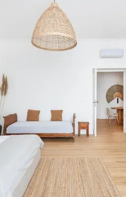 a bedroom with a bed and a pendant light at Davìta - Casa Leda in Rome