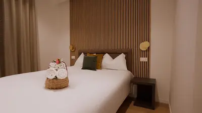 a bedroom with a bed with two baskets on it at Domus Augusti in Rome