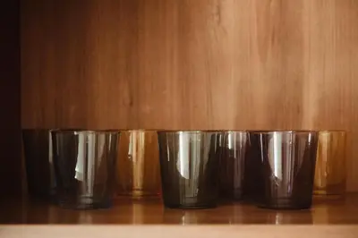 a row of silver cups sitting on a table at Quo Vadis APT in Rome