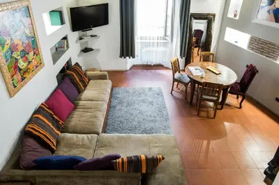 a living room with a couch and a table at Charming Pantheon Apt in the heart of Rome in Rome