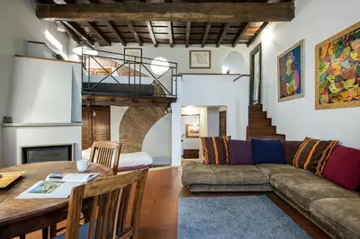 a living room with a couch and a table at Charming Pantheon Apt in the heart of Rome in Rome