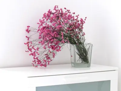 a vase filled with pink flowers sitting on a table at Santonofrio Apartments Silver e White in Rome