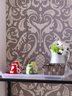 a shelf with a vase of flowers on a wall at Santonofrio Apartments Silver e White in Rome