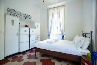 a small bedroom with a bed and a dresser at Vintage Vibes in Testaccio - Cale 07 in Rome
