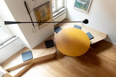 a yellow orb in a room with a table and chairs at Bollo flat in Rome