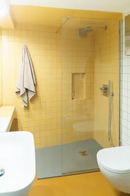 a bathroom with a shower with a toilet and a sink at Bollo flat in Rome