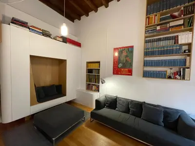 a living room with a couch and a tv at Bollo flat in Rome