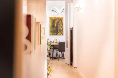 a hallway leading to a dining room with a table at La Veranda dei Farnesi in Rome