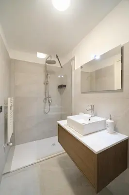 a bathroom with a sink and a shower at Dadada by BuddyRent in Rome