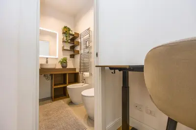 a small bathroom with a toilet and a sink at Paruta Rooms 22 in Rome