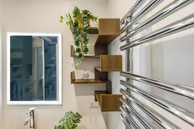 a bathroom with wooden shelves and a window at Paruta Rooms 22 in Rome