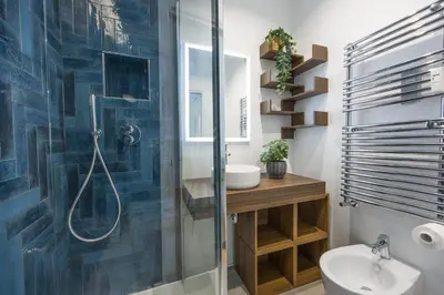 a bathroom with a shower and a toilet and a sink at Paruta Rooms 22 in Rome