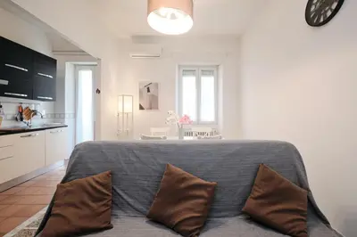 a bedroom with a large bed with two pillows at Residenza Lucis - Camillo Hospital - Monteverde by Hôtea in Rome