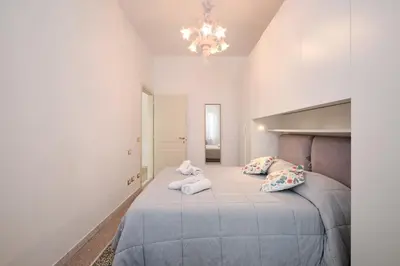 a bedroom with a bed with two towels on it at Residenza Lucis - Camillo Hospital - Monteverde by Hôtea in Rome