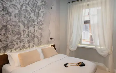 a bedroom with a bed with a hat on it at Dreamers in Belsiana Spagna int 8 in Rome
