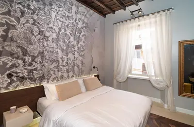 a bedroom with a bed and a wall mural at Dreamers in Belsiana Spagna int 8 in Rome