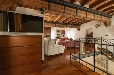 a living room with a large television and a living room at Domus Campo de Fiori in Rome