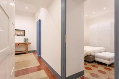 a hallway with a door leading to a bedroom at MyRentalInn Scarlatti Rhome Parioli in Rome