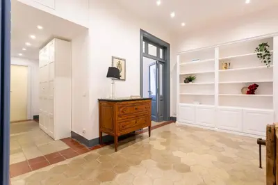 a room with a wooden dresser and shelves at MyRentalInn Scarlatti Rhome Parioli in Rome