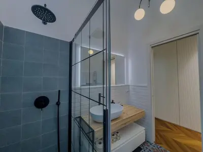 a bathroom with a sink and a glass shower at Casa Alessandria in Rome