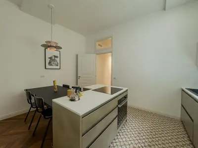a kitchen with a white counter top and a sink at Casa Alessandria in Rome