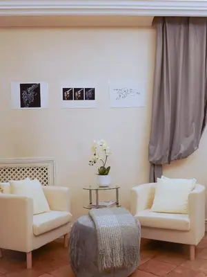 a living room with two chairs and a table at Best Location in Rome -Historical Center in Rome