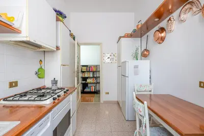 a kitchen with a stove and a refrigerator at Flaminio Tiepolo bright and central in Rome in Rome