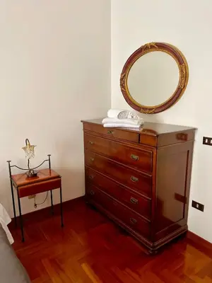 a dresser with a mirror on top of it at Testaccio 100 in Rome