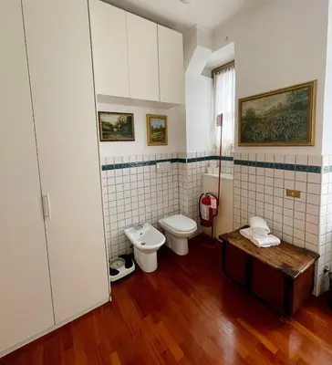 a bathroom with a toilet and a sink at Testaccio 100 in Rome