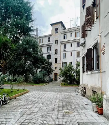 an empty street with bikes parked in front of buildings at Testaccio 100 in Rome