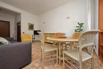 a living room with a table and chairs at Fossato Di Vico in Rome