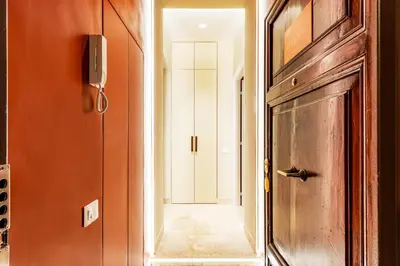 a hallway with a door leading to a hallway with a door at Petra Apartments San Giovanni in Rome