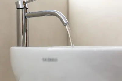 a sink with a faucet with water coming out of it at iFlat New Refined Apartment Near the Vatican in Rome