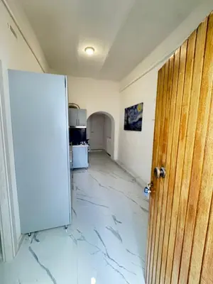 an open door to a room with a marble floor at BANGA HOUSe in Rome
